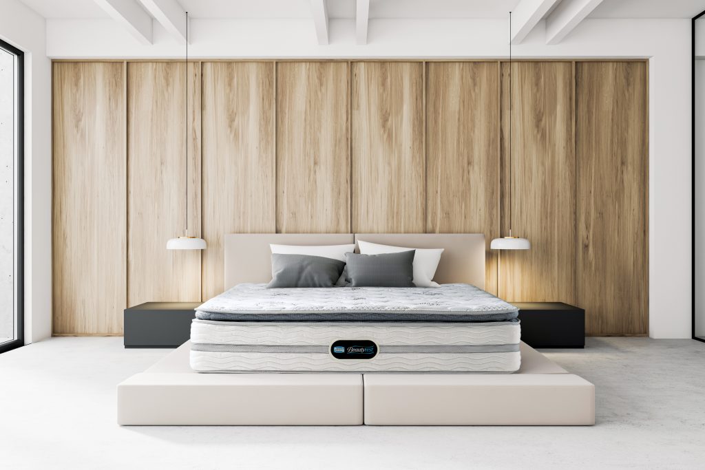 Luxury modern master bedroom interior with white and wooden walls, concrete floor, cozy king size bed with two bedside tables and white lamps hanging above them. 3d rendering